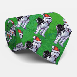 Festlig Husky i den Santa hatten på grönt Slips