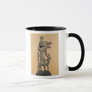 Figur av ett maninnehav en apa mugg