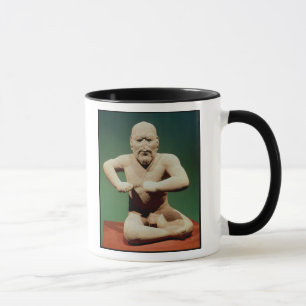 Figurine av en brottare mugg