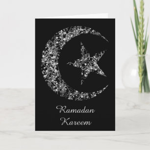 Filigree växande måne och stjärna på svart kort