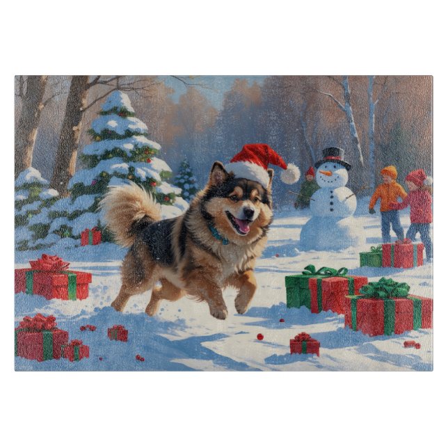 Finsk Lapphund springer i snö med julhatt (Framsidan)