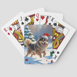 Finsk Lapphund springer i snö med julhatt Casinokort