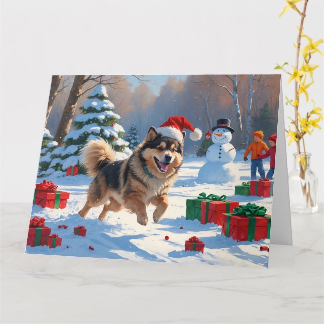 Finsk Lapphund springer i snö med julhatt Kort (Gul blomma)