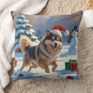 Finsk Lapphund springer i snö med julhatt Kudde