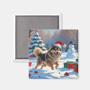 Finsk Lapphund springer i snö med julhatt Magnet