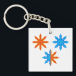 Fire and Ice Eight Point Stars<br><div class="desc">Keep your keys organized with this eye catching fire and ice eight point star keychain. The miniature version of this vibrant symmetrical graphic showcases the intense contrast between orange and blue elemental tones. This modern geometric accessory is a great way to add a pop of color and personality to your...</div>