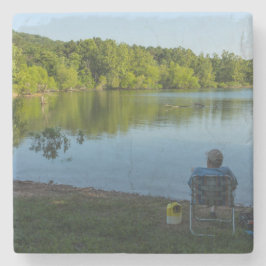 Fiske på morgonen underlägg sten