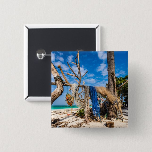 Fisknät som torkar på stranden knapp (Framsida & baksida)