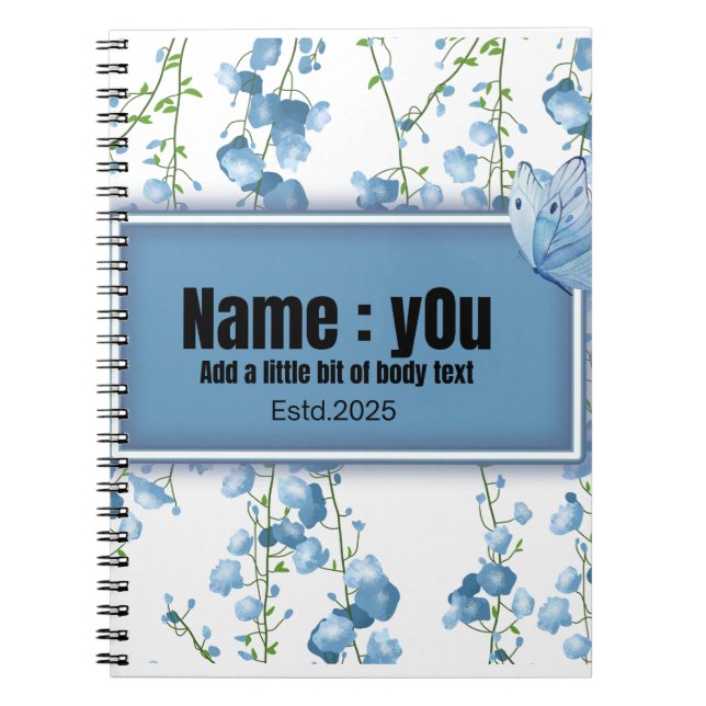 fjäril omgiven av blå shruber anteckningsbok (Framsidan)