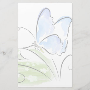 Fjärilssitta på gräs över blommafält brevpapper