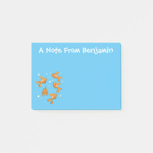 Fläckfisk av orange på blått tecknad post-it block