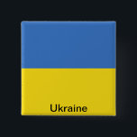 Flagga av Ukraina Knapp<br><div class="desc">Flagga av Ukraina (ukrainare: державнийпрапорУкраїни; translit.: derzhavnyy prapor Ukrayiny; formligen är `-statlig flagga av Ukraina') medborgareflagga av Ukraina. Medborgareflagga adopterades officiellt för den första tiden i 1918 av kortlivade ukrainska ett folks republik. Då hade den gemensamt använda gult-blått flagga redan vänt in i blått, och gult och sported en treudd...</div>