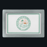 Flagga i Fort Pembroke Gräs, Florida<br><div class="desc">Bälte Buckle med en konstruktion med flagga Pembroke Gräs,  Florida. En vit flagga med en grönt stadsäl i mitten</div>