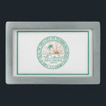 Flagga i Fort Pembroke Gräs, Florida<br><div class="desc">Bälte Buckle med en konstruktion med flagga Pembroke Gräs,  Florida. En vit flagga med en grönt stadsäl i mitten</div>