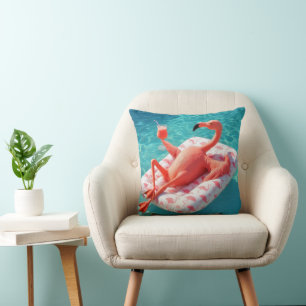 Flamingo avslappnar på en poolmadress kudde