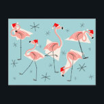 Flamingo Santas Blue vycard Helg Vykort<br><div class="desc">En livlig,  snabb juldesign med återtryck med rosa flamingos med tomthattar,  gräddgeometriska former och stjärnor på blå bakgrund (färg-ändring). Ett anpassade som du kan anpassa med egen text,  bilder och egna idéer. En originalbild för digital konst skapat av QuirkyChic.</div>