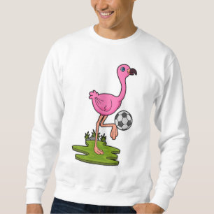 Flamingo som fotbollsspelare med fotboll lång ärmad tröja