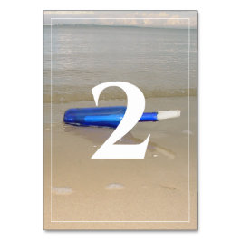 Flaska vid Beach Sand Bröllop Bordsnummer