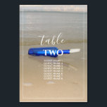 Flaska vid Beach Sand Bröllop Guest Namn Bordsnummer<br><div class="desc">Den här designen har en flaska på stranden. Den vackra blå flaska färg står i kontrast till guldsandan som skapar en perfekt. Den vita bran fodrade gräns perfekt ramar, den tvättat blå flaska på sanden och matchar den moderna vita färgaden typografi. Romantisk stranddesign med en blandning av enkelhet och elegans....</div>