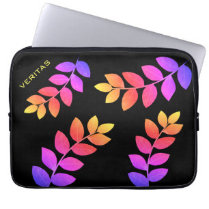 Flerfärgade lagerblad på svart laptop fodral