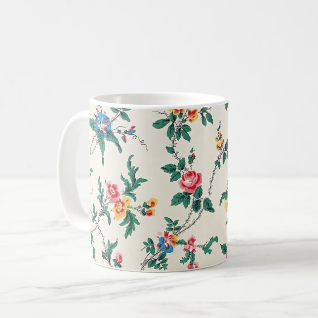 Flerfärgat blommönster på vit kaffemugg (Framsida vänster)
