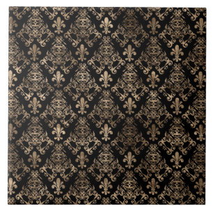 Fleur-de-lis-guld på svart kakelplatta