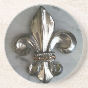 Fleur de lis på marmortryckkustfartyg underlägg