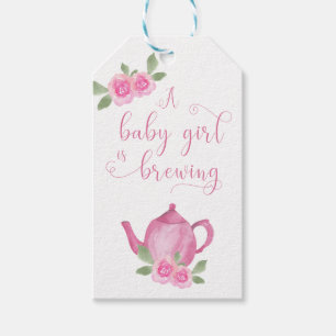 Flicka är Brewing Rosa Tekanna och Flowers Presentetikett