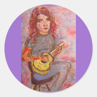 flicka med rött hår och ukulele runt klistermärke