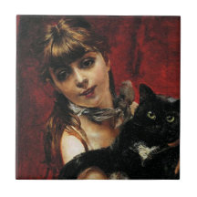 Flicka med svart katt i hennes Arm