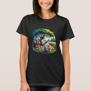 Flicka som läser under ett träd omgiven av blommor t shirt