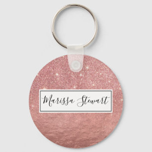 Flickaktigt omkullkastar smulat rosa guld- glitter nyckelring