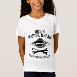 Flickans t-shirt med svarta Bob Saucer Repair logo