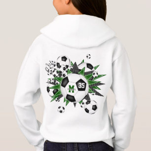 Flickor, fotboll blåser ut med grönt, svarta stjär t shirt