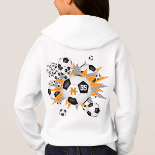 Flickor, fotboll blåser ut med orange grått stjärn t shirt