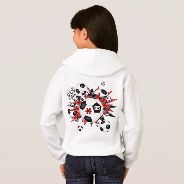 Flickor med fotboll blåser upp med röda svarta stj t shirt (Hel baksida)