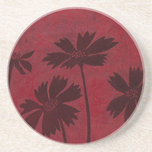 Flowerhead Silhouettes på Crimson Background Underlägg Sandsten