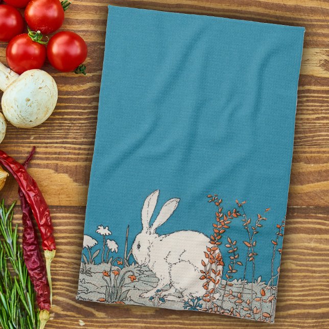 Fluffy White Bunny Sitta i Blommor på Mörk blått Kökshandduk (White rabbit sitting on ground in orange and white flowers medium blue kitchen hand towel.)