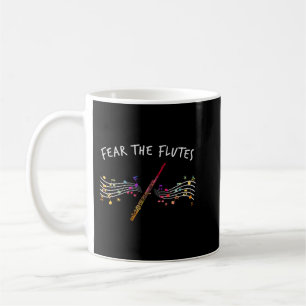 Flutist-presenter som lyfter hand-musik fruktar fl kaffemugg