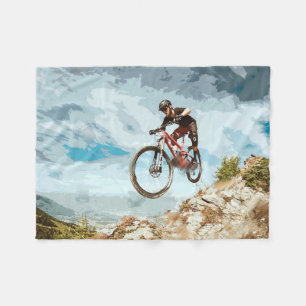 Flyga som är sluttande på en mountainbike fleecefilt