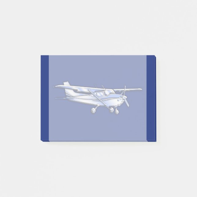 Flygplan Chrome Cessna Silhouette flyger på Blue Post-it Block (Framsida)