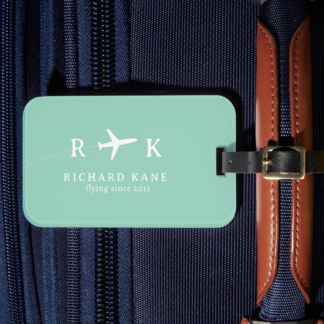 Flygplan med hans initialer - tealblå bagagebricka (Framsida Insitu 4)