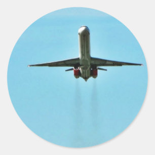 Flygplan som startar på flygplats runt klistermärke