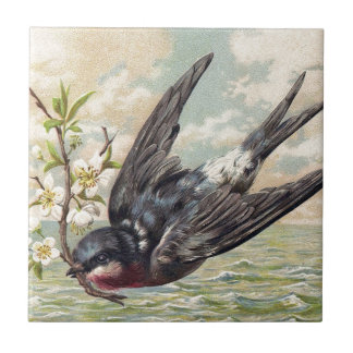 Flying swallow with flower twig kakelplatta