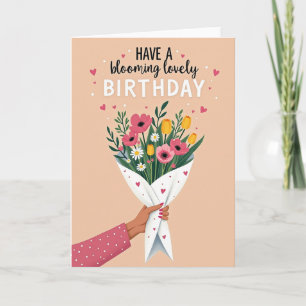 Födelsedags kort med hand som håller blommor
