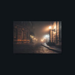 Foggy Victorian Cobblestone Alley Glow Canvastryck<br><div class="desc">Thick fog envelops a narrow Victorian cobblestone alley lit by warm amber street lamps mounted on elegant wrought-iron brackets. Tall Georgian brick buildings with tall windows rise on both sides, their details softened by the mist that turns every light into a glowing halo. The curving lane fades into impenetrable darkness,...</div>