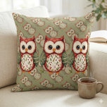 Folk Art Patchwork Owl Cottagecore Kudde<br><div class="desc">This charming folk art owl blends rustic whimsy with cozy cottagecore charm, featuring a beautifully stitched patchwork design inspired by nature and vintage quilting. The warm red, green, and cream tones, combined with delicate floral patterns, evoke the comforting feel of a handcrafted heirloom, perfect for lovers of woodland animals and...</div>