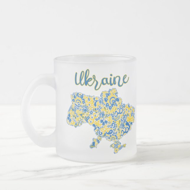Folloc mönster och Ukraina-typografi Frostad Glasmugg (Vänster)