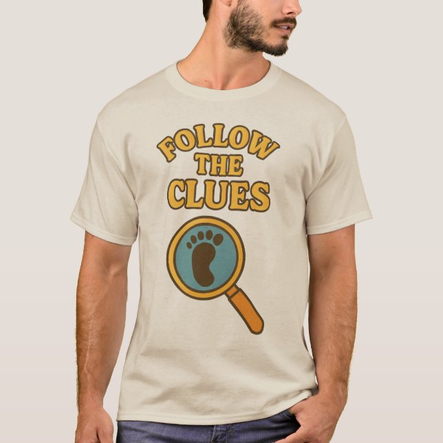 “Follow the Clues” T-Shirt (Framsida)