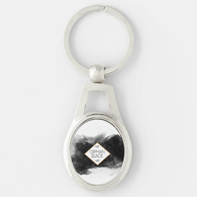 Föräldralös svartsvartvattenfärg ovalt silverfärgad nyckelring (Framsidan)